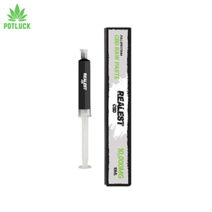 CBD product with syringe and packaging on a white background, featuring the Realest brand.