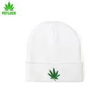 White beanie with green cannabis leaf